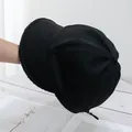Detailed view of black wool-blend winter baseball cap featuring fine stitching and warm fabric - Adjustable / Black