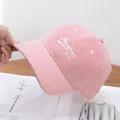 Close-up of pink corduroy baseball cap with Mixobear embroidery and soft texture - Adjustable / Pink