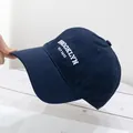 Detail of Brooklyn embroidery on a dark blue cotton baseball cap with ventilation eyelets - Adjustable / Navy Blue