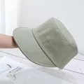 Detail of a light olive green cotton bucket hat with fine circular stitching on the brim - Adjustable / Army Green
