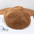 Detail of soft mohair knit beret in brown caramel texture on a wooden table - M (56-58cm) / Camel