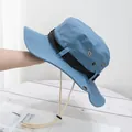 Detail of blue outdoor boonie hat showing metal air vents and adjustable chin strap - M (56-58cm) / Blue
