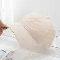 Macro view of lightweight beige baseball cap showing white stitching and quick-dry fabric - Adjustable / Beige