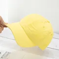 Close-up of lightweight yellow quick-dry baseball cap with flexible brim and soft fabric - Adjustable / Milky Yellow