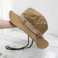 Detail of khaki tactical boonie hat with ripstop fabric texture and adjustable chin strap - M (56-58cm) / Camel