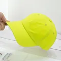 Detailed close-up of neon green baseball cap showing breathable fabric and stitching - Adjustable / Neon Yellow