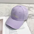 Light purple baseball cap with gray Colorado embroidery on marble surface - Purple