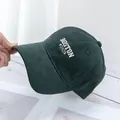 Detailed view of dark green baseball cap featuring white 3D Boston letter embroidery - Dark Green