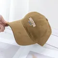 Detail of Boston embroidery on khaki corduroy baseball cap with high quality texture - Camel