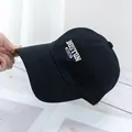 Detailed view of 3D Boston embroidery on black cotton twill baseball cap with stitching - Black