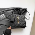 Chic black quilted handbag with gold S-logo buckle and matching coin purse - Black
