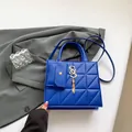 Dark blue quilted square handbag with gold S logo, tassel and mini coin purse charm - Blue