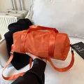 Orange cylindrical fitness bag with adjustable straps for travel and casual gym use - Large / Orange