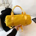 Minimalist bright yellow cylinder gym bag in durable nylon with adjustable straps - Large / Yellow