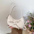 Elegant cream crescent handbag with bow detail and silver beads for women's fashion - White
