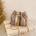 Colorful striped woven bucket bag with gold chain strap and elegant pearl charms - Brown
