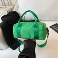 Bright green nylon cylinder handbag with adjustable shoulder strap for travel - Large / Green