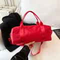 Red cylindrical sports gym bag with adjustable shoulder strap and durable handles - Large / Red