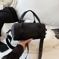 Minimalist black cylinder nylon travel tote bag with adjustable crossbody strap - Small / Black