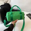 Minimalist bright green nylon cylinder bag with adjustable wide shoulder strap and zipper - Small / Green