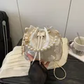 Elegant off-white pearl bucket bag with floral embroidery and chain strap for women - White Floral