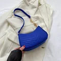 Royal blue half-moon crossbody bag with V-shaped quilting and gold chain strap detail - Royal Blue With Coins