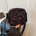 Mini black corduroy crossbody bag with cute red strawberry print and adjustable strap - Black