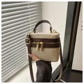 Beige canvas vanity case with dark brown leather trim and adjustable shoulder strap - Coffee