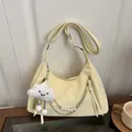 Cream half-moon hobo bag with pearl chain and smiley cloud charm in soft studio lighting - With Pendant / Yellow