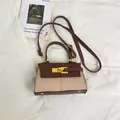 Brown and beige trapezoid crossbody bag with elegant leather stitching and top handle - Brown