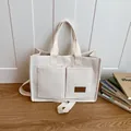 Sac fourre-tout en toile blanc crème avec deux poches avant et bandoulière amovible - Blanc