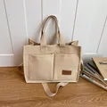Sac fourre-tout en toile beige avec deux poignées et bandoulière réglable - Khaki