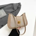 Retro saddle bag in beige leather and tweed fabric with a golden metal twist lock - Khaki