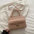 Pink lychee leather small square bag with golden turn-lock and top handle strap - Pink