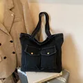 Large black washed denim tote bag with front pockets and wide straps for commuting - No Pendant / Black