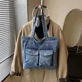 Retro acid wash denim tote bag in snow blue with large front pockets and metal buckles - No Pendant / Sand Washed Light Blue