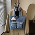 Blue washed denim tote bag with large front pockets and white cloud plush charm - With Cloud Pendant / Sand Washed Light Blue