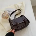 Classic dark brown vintage shoulder bag with faux leather texture and retro buckle details - Brown