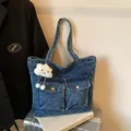 Blue denim canvas tote bag with front pockets and a white cloud plush charm - With Cloud Pendant / Sand Washed Dark Blue