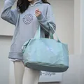 Mint green travel bag with bottom compartment and trolley sleeve for fitness - Green