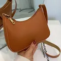 Brown faux leather shoulder bag with lychee texture and golden zipper closure - Dark Brown