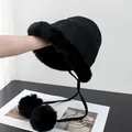 Detail of black faux fur bucket hat with plush pom-poms and drawstring closure - M (56-58cm) / Black