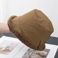 Detail of winter bucket hat showing windproof brown fabric and thick faux fur lining - Adjustable / Camel