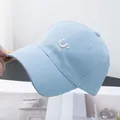 Close-up of embroidered 'U HOPE' lettering on a light blue cotton baseball cap - Adjustable / Blue