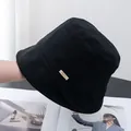 Detail of black cotton bucket hat showing fine plaid texture and Jijino side label - Adjustable / Black