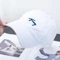 Detailed embroidery of navy blue lettering on a high-quality white cotton baseball cap - Adjustable / White