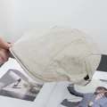 Detailed view of beige twill cotton newsboy cap with vintage stitching and textured fabric - Adjustable / Beige