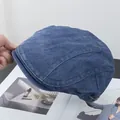 Close-up of vintage blue denim ivy cap with detailed stitching and washed texture - Adjustable / Navy Blue