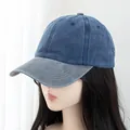 Detailed view of two-tone washed denim baseball cap with navy crown and grey curved brim - Navy Blue With Grey Brim