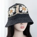 Close-up of hand-crocheted bucket hat featuring intricate daisy flower knit patterns - Adjustable / Black